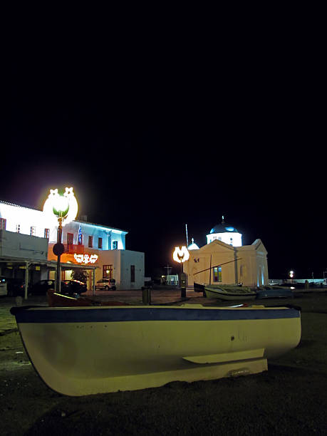 Mykonos Yialos old port with the Town Hall and Agios Nikolaos church on a winter night during Christmas holidays