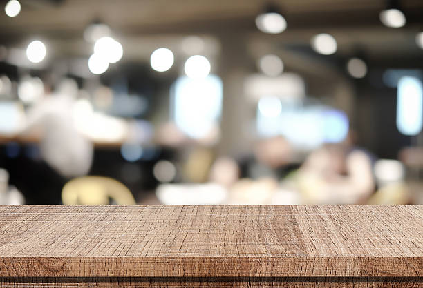 istock Empty wood table and blurred cafe with bokeh light background 478393556