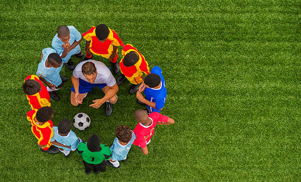 istock Young Boys With Football Coach 478393891
