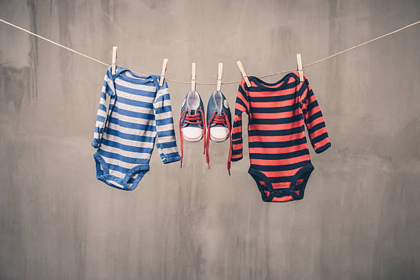istock Baby clothes hanging on the clothesline 478395400