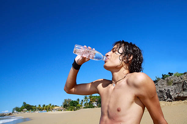 istock Man with water in bottle 478396137