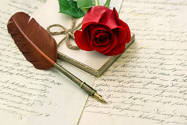 old letters, rose flower and antique feather pen. romantic vintage background. selective focus
