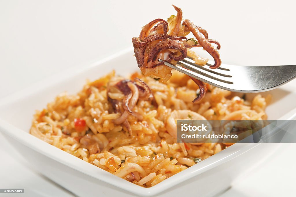 Delicious rice with squid Calamari Stock Photo