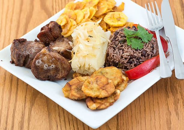 Deep fried pork, yukka or cassava plus congri rice all with salty green banana fries. Typical Cuban Meal