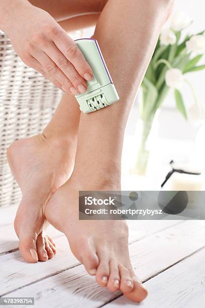 Smooth Female Legs Hair Removal Depilator Stock Photo - Download Image Now - 2015, Adult, Beautiful People