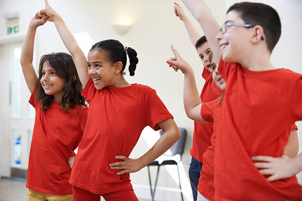 istock Group Of Children Enjoying Drama Class Together 478398806