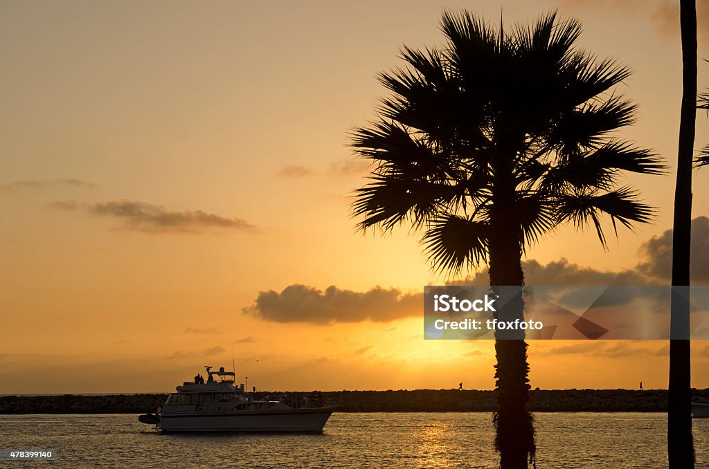 Dana Point California at sunset San Juan Creek bay entrance to the Pacific Ocean at Dana Point California at sunset with palm trees 2015 Stock Photo