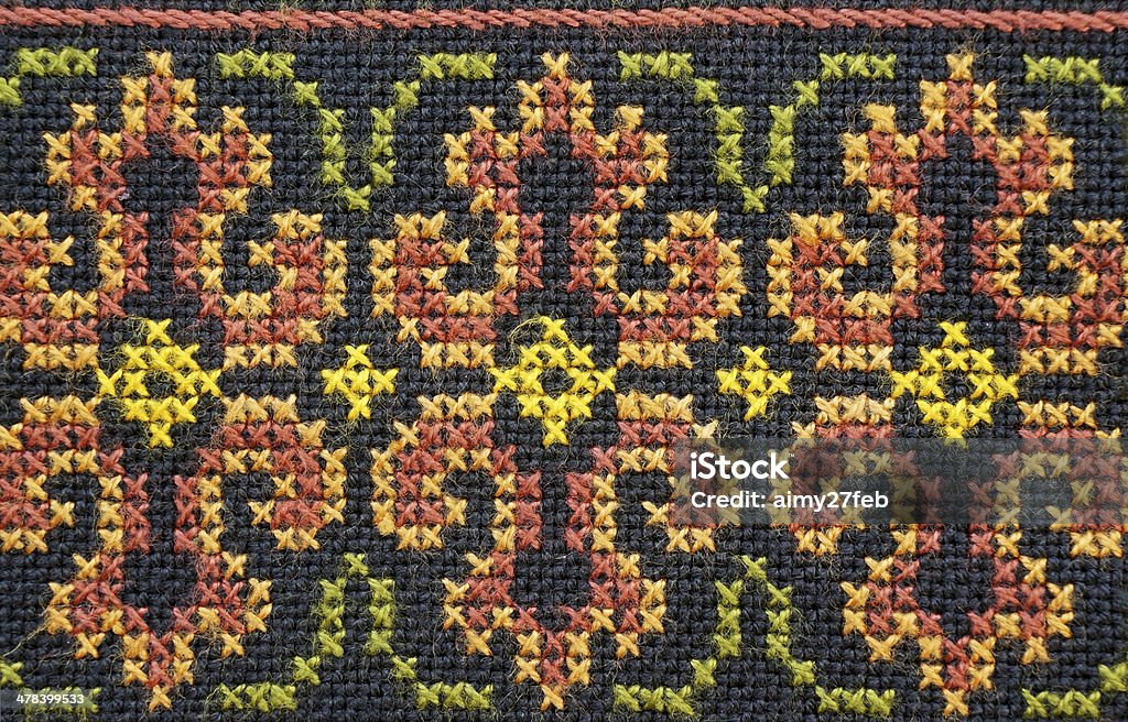 embroidered good by cross-stitch pattern embroidered good by cross-stitch pattern. Abstract Stock Photo