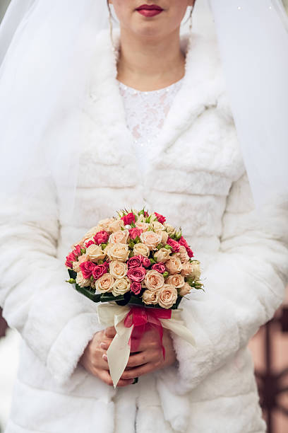 istock beige wedding bouquet at bride's hands 478400157