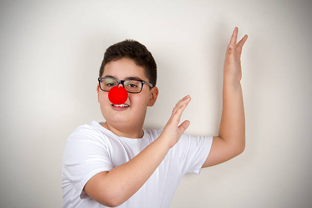 istock Child With Clown Nose and Glasses 478402410