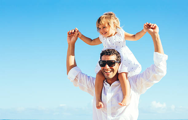 istock Father and daughter having fun together at the beach 478403791