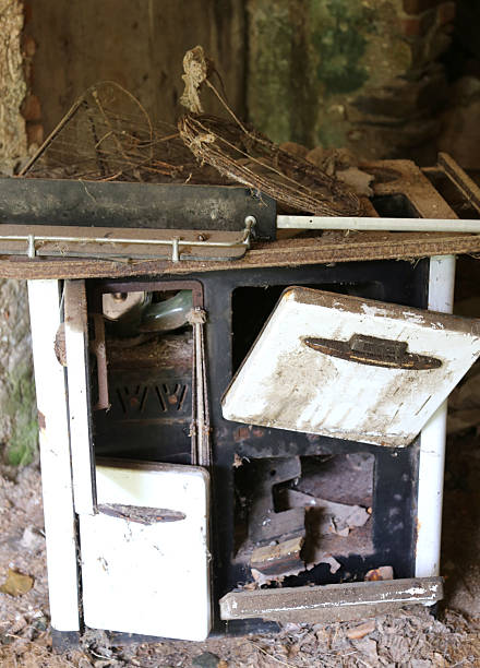 istock rusty wood-burning stove in an old abandoned destroyed house 478406690