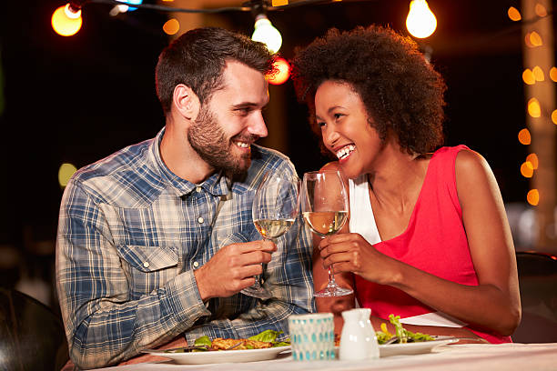 istock Couple eating dinner at rooftop restuarant 478406862