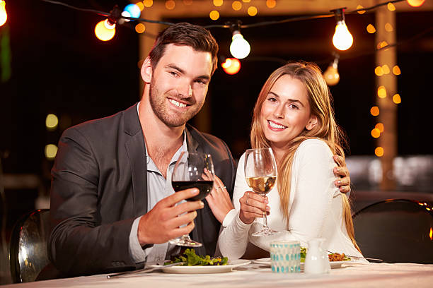 istock Couple eating dinner at rooftop restuarant 478406864