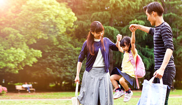 Family having a walk outdoors in summer, Tokyo