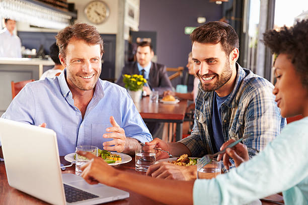 istock Group of friends at lunch in a restaurant 478408256
