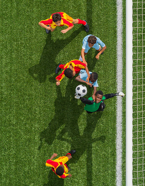 istock Young Boys Playing Football 478408377