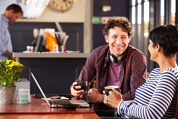 istock Man and woman talking at a coffee shop 478408428