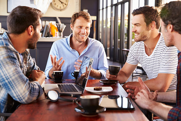istock Group of men talking at a coffee shop 478408586