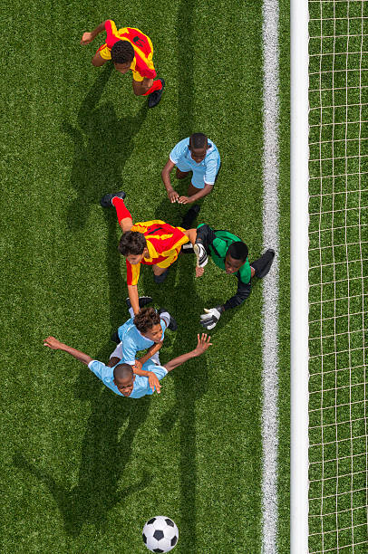 istock Young Boys Playing Football 478408633