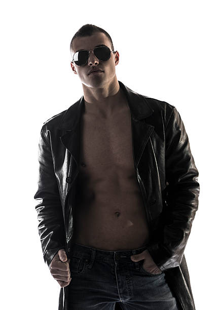 istock Muscular shirtless young man with leather jacket and sunglasses 478408885