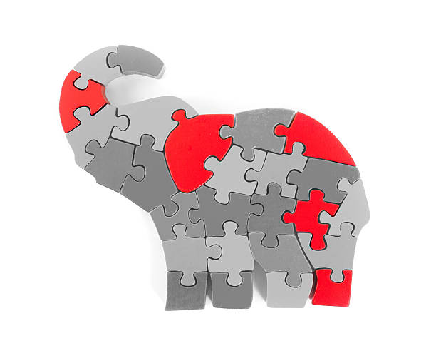 istock Colorful puzzle pieces in elephant shape 478409016