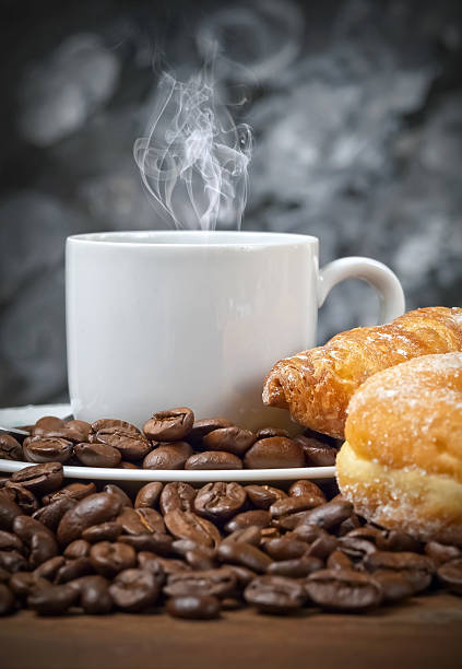 istock Hot coffee with croissant and donut 478412190