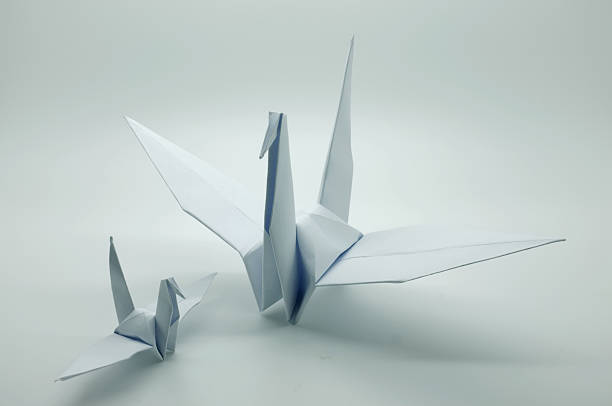 istock White origami crane, bird, paper 478413210