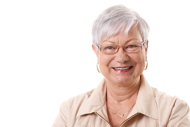Closeup portrait of smiling old lady stock photo