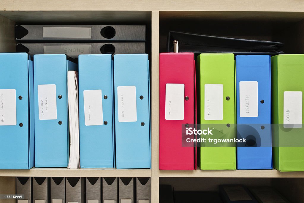 Box files Selection of colorful box files in a home office Book Stock Photo