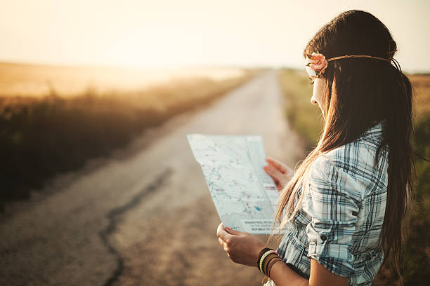 istock Traveler girl looking map 478414364