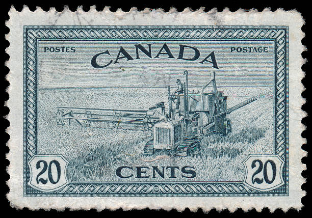istock Stamp printed in the Canada shows Combine Harvester 478414587
