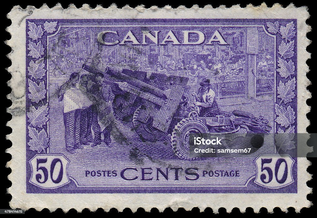 Sstamp printed in the Canada shows Cannon, Munitions Factory CANADA - CIRCA 1942: a stamp printed in the Canada shows Cannon, Munitions Factory, circa 1942 Postage Stamp Stock Photo