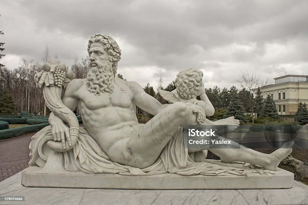 Sculpture of the god Zeus and Cupid Marble sculpture of Zeus and Cupid, culture of Europe Zeus Stock Photo