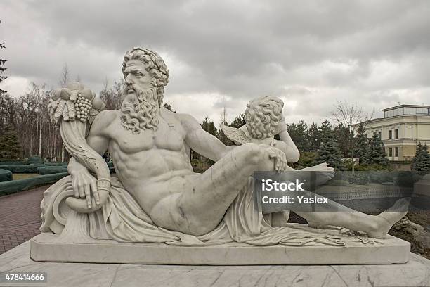 Sculpture Of The God Zeus And Cupid Stock Photo - Download Image Now - Zeus, Statue, Grecia