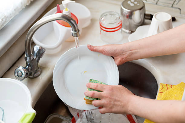 istock Women's hands washing the dishes 478414940