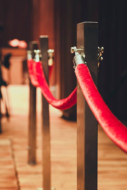 Fence pole attached with red rope Red carpet area