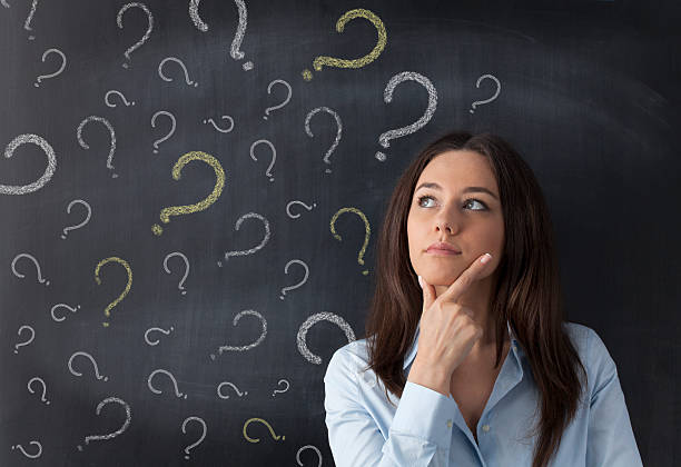 istock Businesswoman and question mark on blackboard 478418328