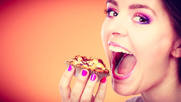 istock woman holds cake in hand closeup 478418460