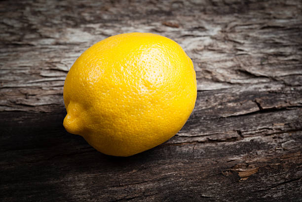 istock Lemon on wooden table. Organic food 478422061