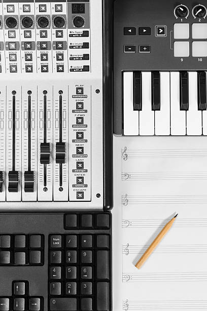 istock pencil on blank music sheet, studio mixer, piano & keyboard 478422136