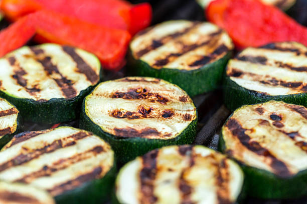 istock Zucchini and red pepper on a grill 478422314