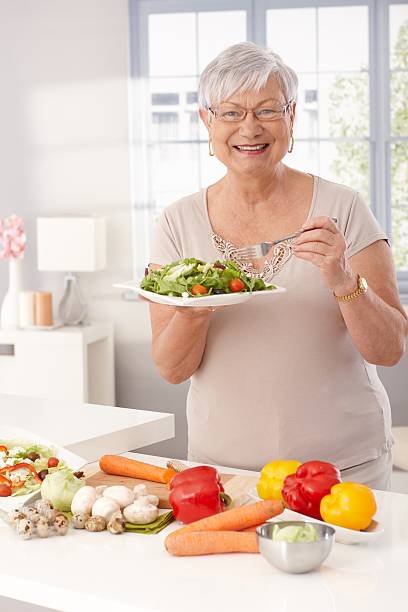 istock Modern grandmother eating healthy 478422485