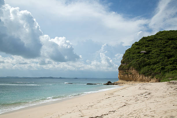 istock Beautiful beach with white sand beach and clouds 478425528