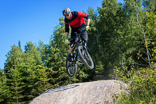 istock Mountain bike rider jumping kicker 478425556