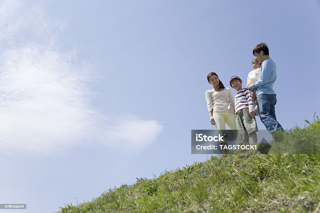 Family standing still on bank Family Stock Photo