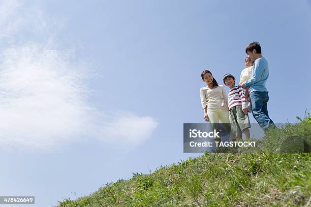 Family Standing Still On Bank Stock Photo - Download Image Now - Family, Japanese Ethnicity, Lawn