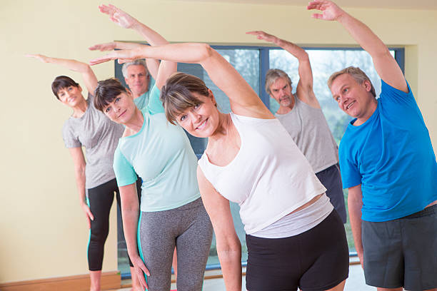 istock Group of seniors stretching 478426734