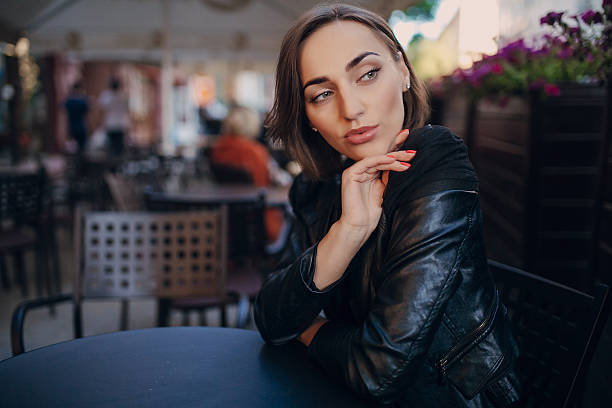 istock pretty girl sitting in a cafe 478426888