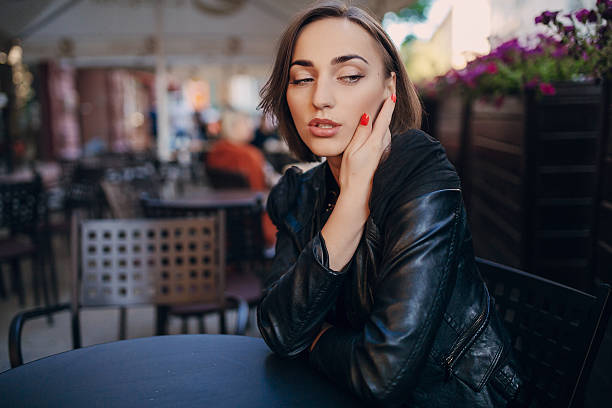 istock pretty girl sitting in a cafe 478426900